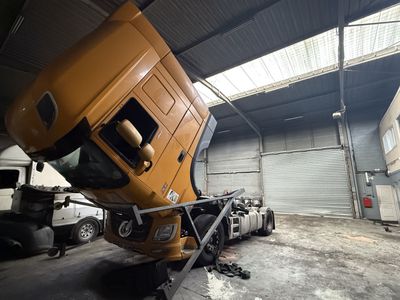 a large truck that is parked in a garage