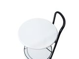 a white table with a black handle on it