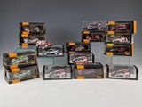 a lot of toy cars that are in a display case
