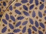 two plates that have blue and white designs on them