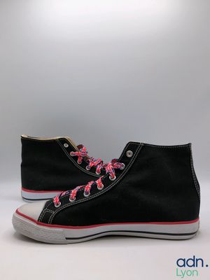 black high top sneakers with pink laces on a white background