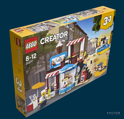 une boîte contenant un kit Lego Creator, sur fond bleu