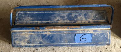 a blue box with a number on it sitting on the floor