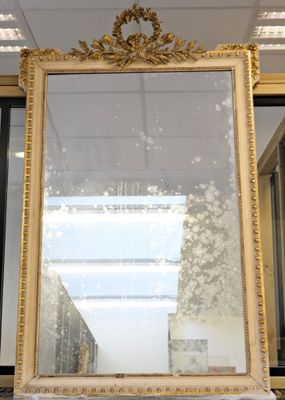 a mirror sitting on top of a table in a room