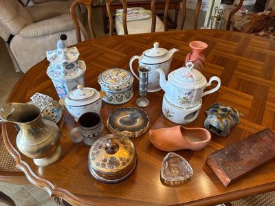 many different types of teapots on the table