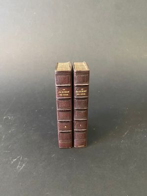 two books sitting on top of each other on a table