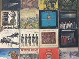 many different types of vinyl records on the floor