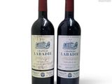 two bottles of wine that are sitting next to each other