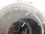 a close up of a person ' s hand holding a wrist watch