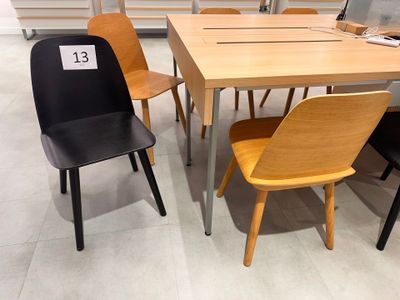 several chairs and a table in a store with a price tag on it