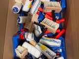a cardboard box full of different types of hair brushes
