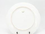 an image of a white plate with a gold rim on a white background