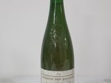 a bottle of wine that is sitting on a table