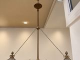a chandelier hanging from the ceiling in a room