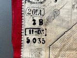 a piece of fabric with a picture of a house on it