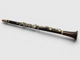 a close up of a flute on a white surface
