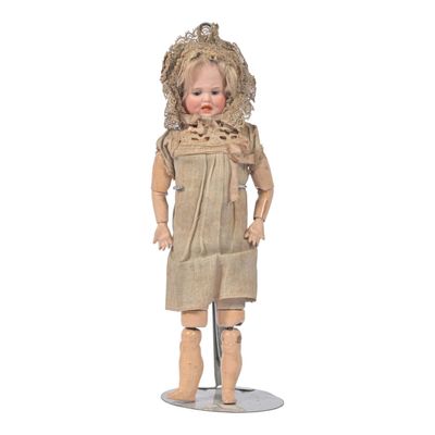 an image of a wooden doll standing on a white surface