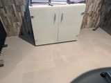 an image of a bathroom with a sink and a cabinet