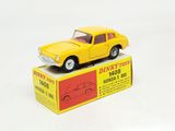 yellow toy car sitting on top of a box on a white surface