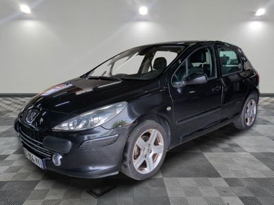 a picture of a black car parked in a garage