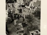 a black and white photo of an artist ' s studio