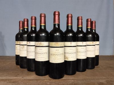 six bottles of wine are lined up on a wooden table