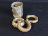 a snake that is standing next to a cup