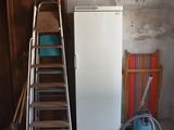 an image of a room with a ladder and a refrigerator