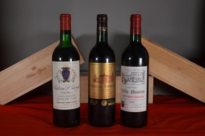 trois bouteilles de vin posées l'une à côté de l'autre sur une table