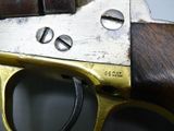 a close up of a gun that is on display