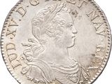 une pièce en argent avec l'image d'une femme de profil