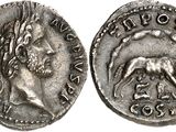 a silver coin with an image of a man and a dog on it