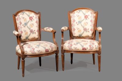 pair of louis xvi style armchairs with floral upholstered upholstered arms