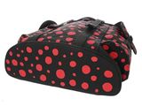 a close up of a red and black polka dot bag