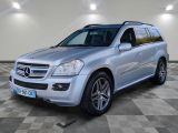 the mercedes gl is parked on a checkered tile floor