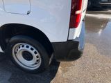 a picture of a white van parked in a parking lot