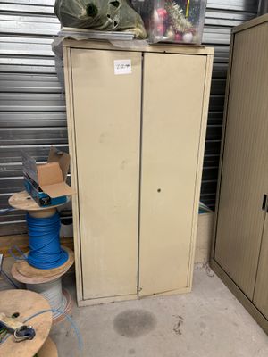 a cabinet that has a bunch of wires on top of it