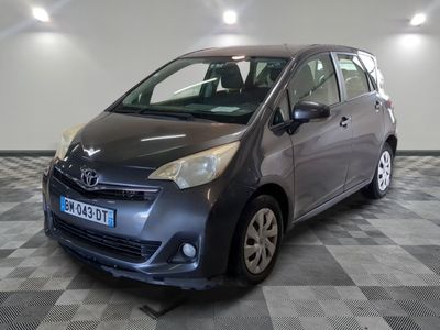 a picture of a grey toyota yaris parked on a checkered floor