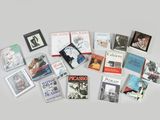 a lot of books that are on the table