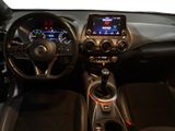 the interior of a car with a steering wheel, dashboard, and dashboard controls