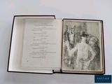 an open book with a drawing of a man and a woman