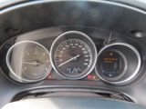 a close up of a car dashboard with various gauges