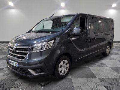 a picture of a grey van parked in a garage