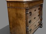 an old wooden chest of drawers on a grey background
