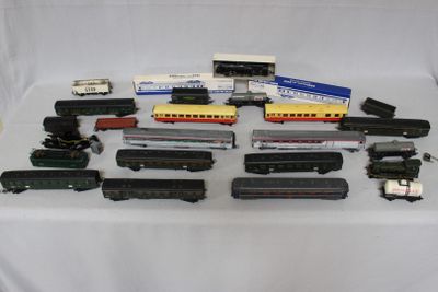 many different types of toy trains on a table