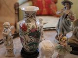 many figurines sitting on a tray on a table