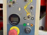 a control panel on the side of a red machine