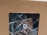 a cardboard box with screws and screws inside of it