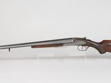 a rifle with a wooden barrel on a white background