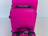 three pieces of luggage are stacked on top of each other